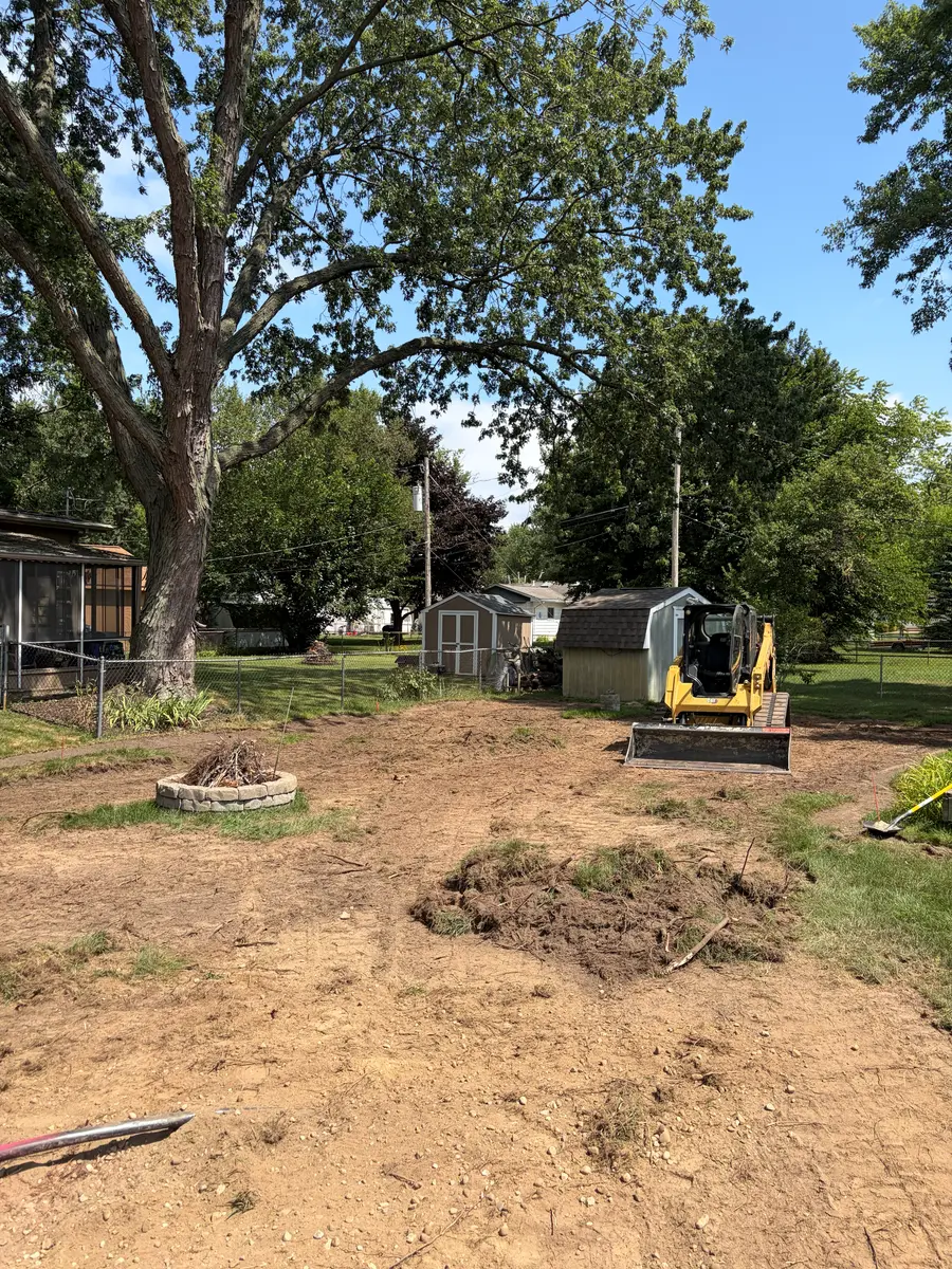 During — Full yard stripped, regraded, and sodded, front to back