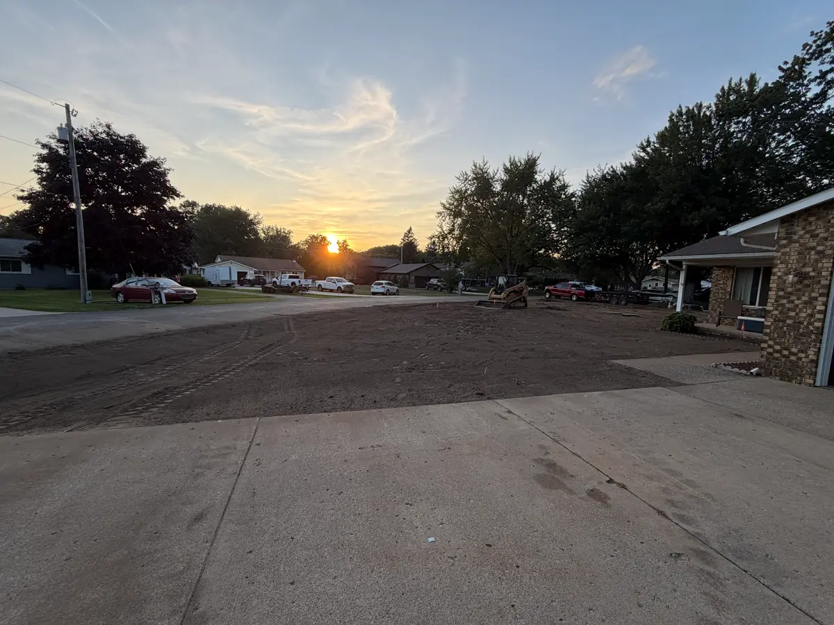During — Full yard stripped, regraded, and sodded, front to back