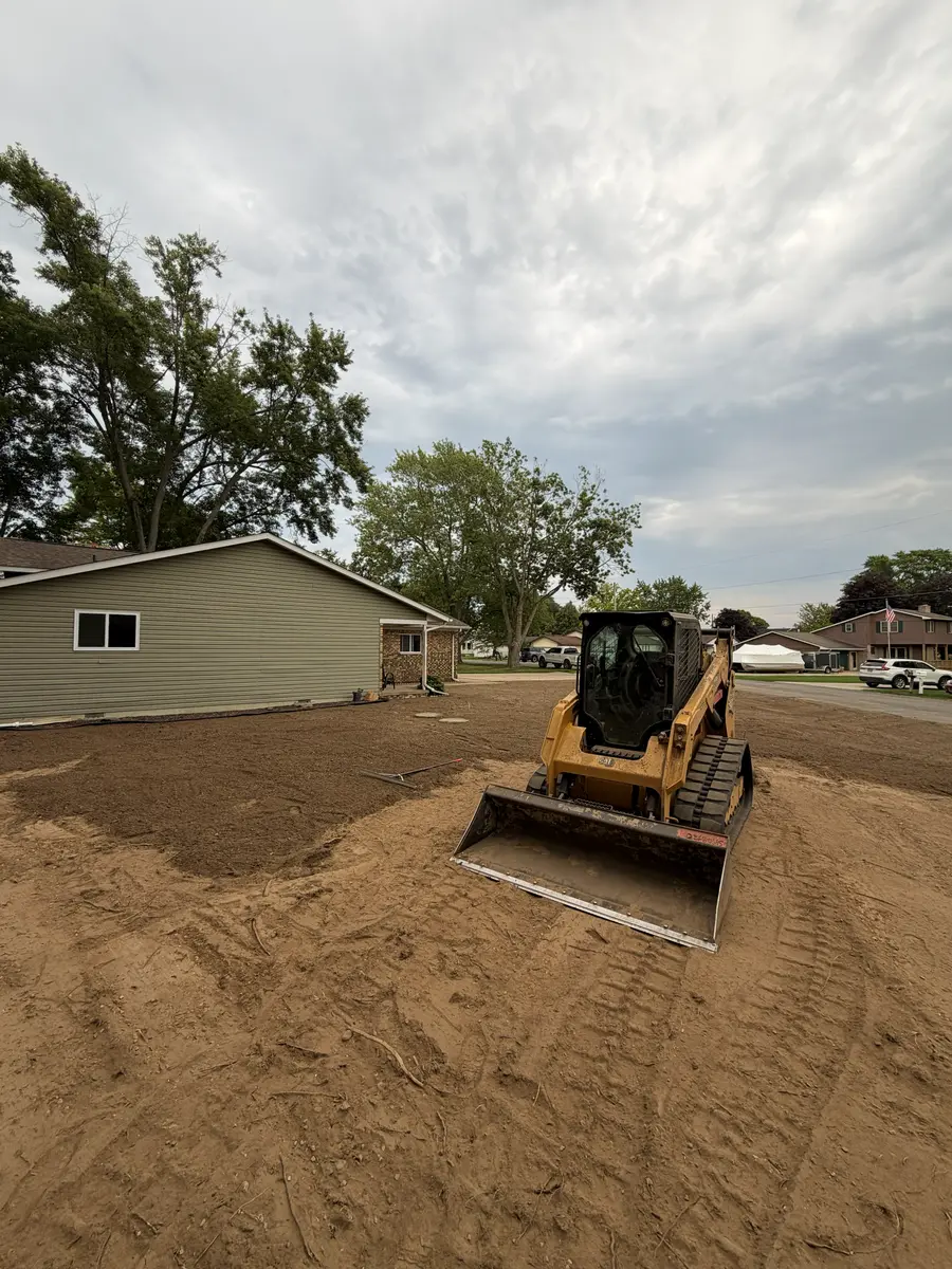 During — Full yard stripped, regraded, and sodded, front to back