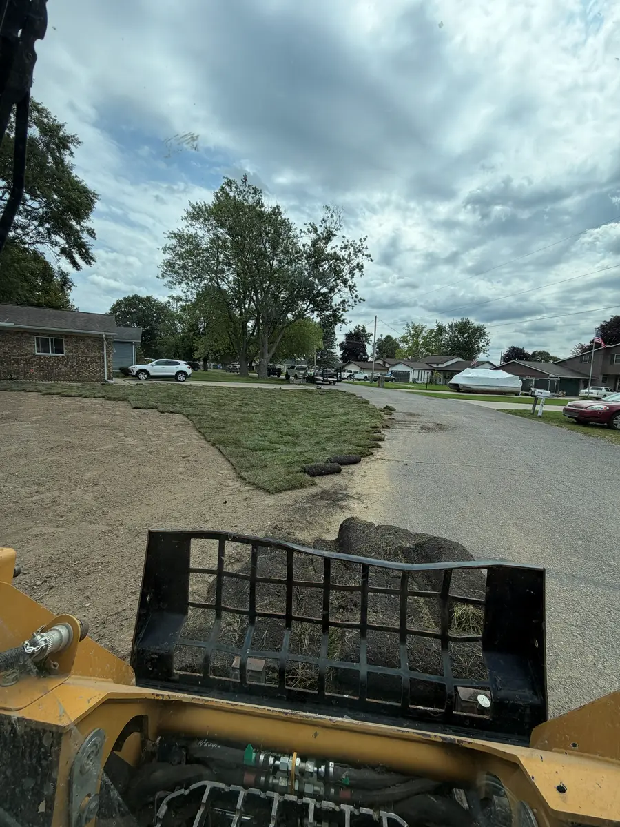 During — Full yard stripped, regraded, and sodded, front to back