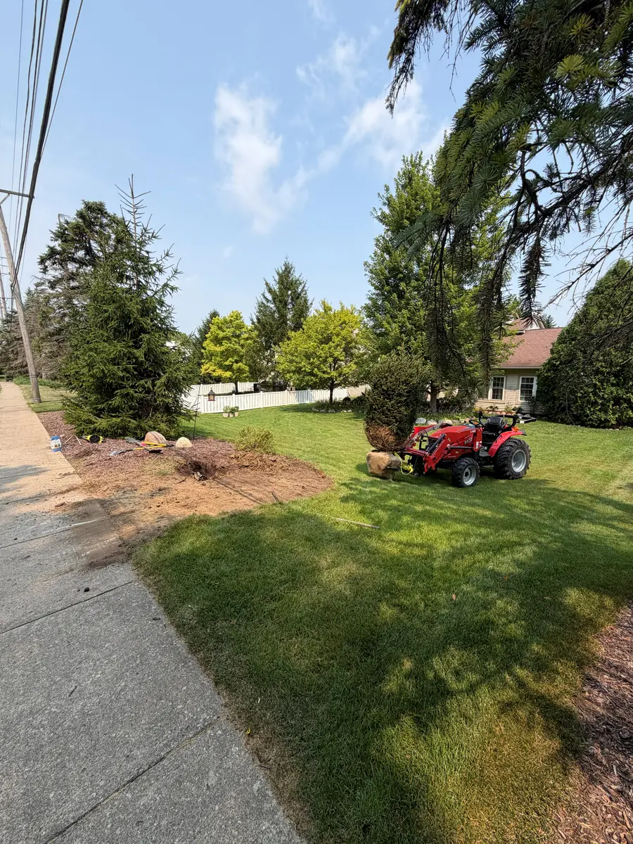 During — Flower bed rebuilt with boulder edging