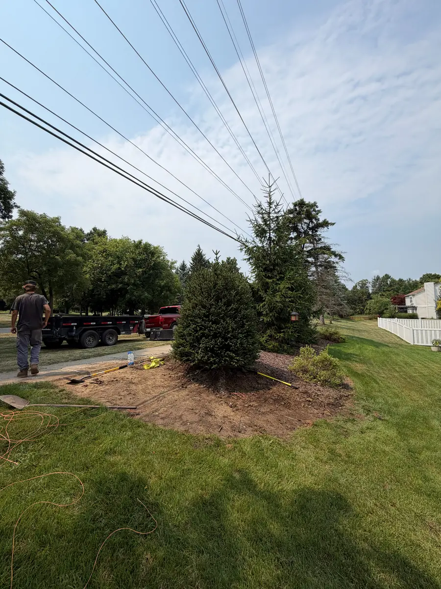 During — Flower bed rebuilt with boulder edging