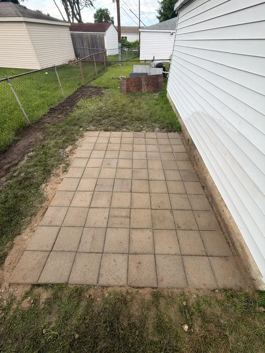 After — Paver shed pad in a narrow side yard