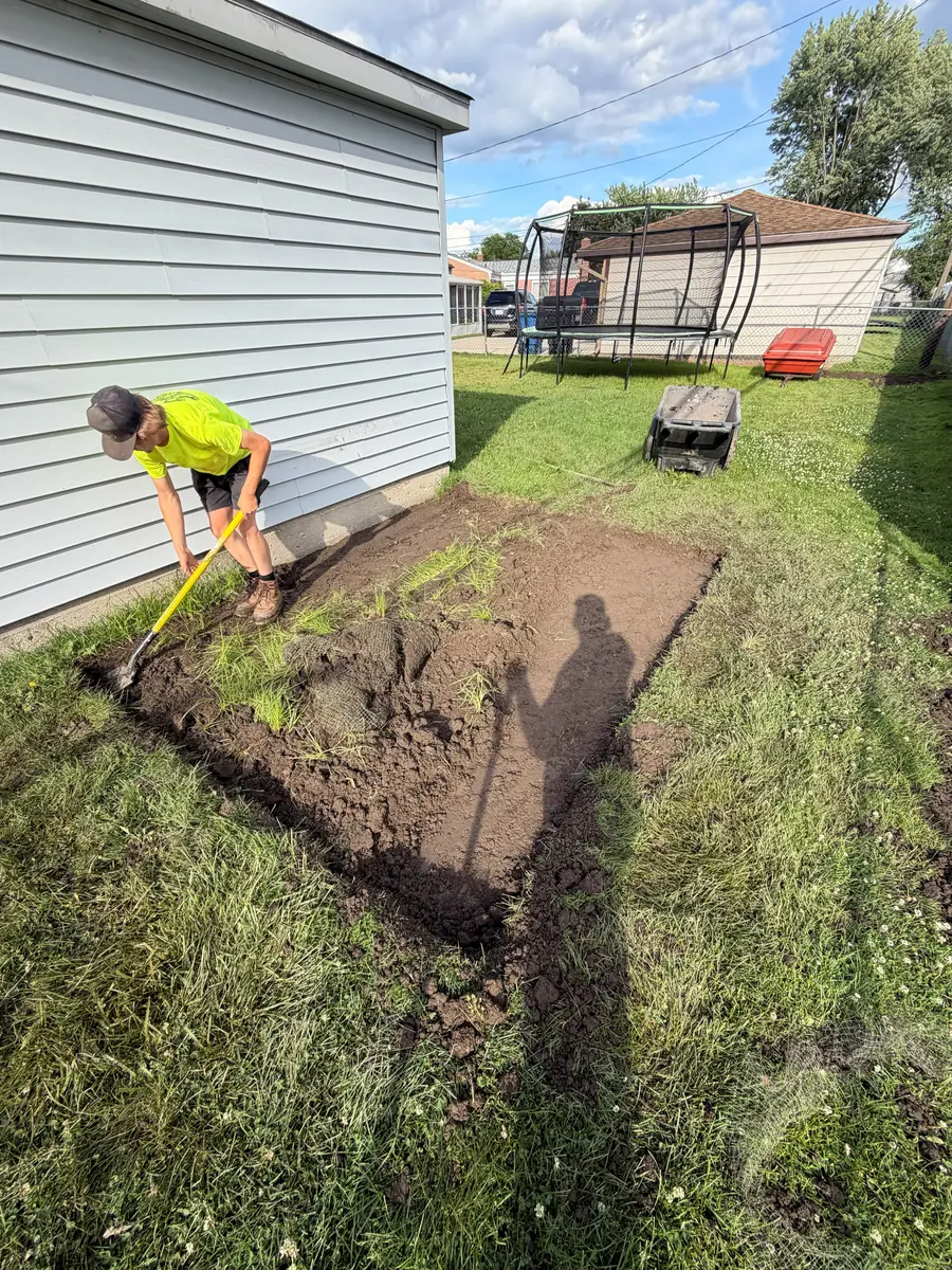 During — Paver shed pad in a narrow side yard