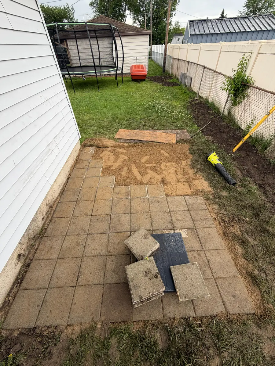 During — Paver shed pad in a narrow side yard